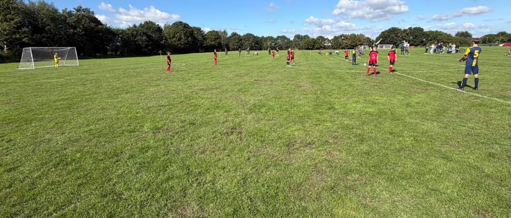 Mepal & Sutton FC Under 13s in match action, cropped to focus on players